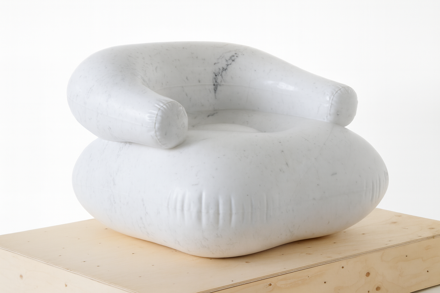 Freddy Marbic, a white marble armchair sculpture on a wooden platform
