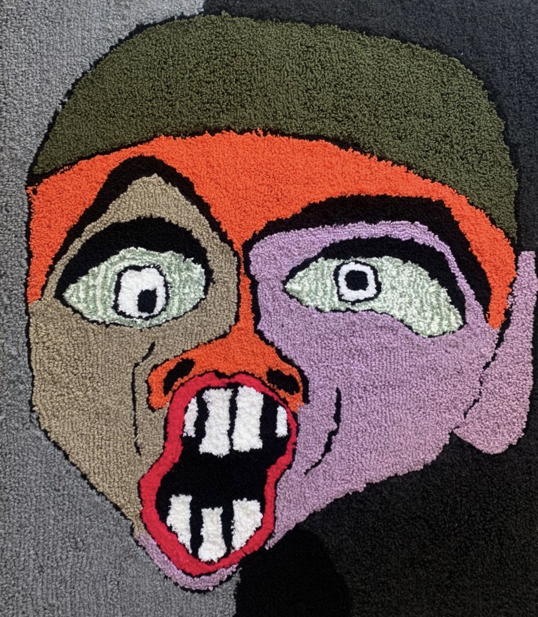 Karel Portrait with an orange, green and purple textile face
